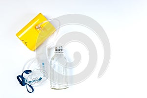 Tube mask nebulizer and tubular transparent cable, saline on a white background, inhalation