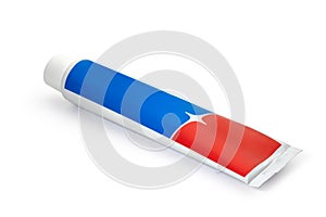 A tube of red and blue toothpaste on a white background. Full depth of field.