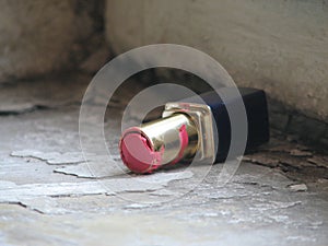 A tube of red lipstick is abandoned in a Soviet Staircase