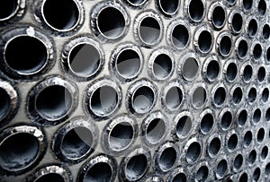 Tube sheet of the heat exchanger for maintenance, the water heater in the boiler as background