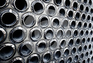 Tube sheet of the heat exchanger for maintenance, the water heater in the boiler as background photo