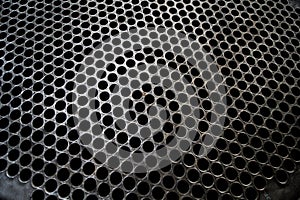 Tube Sheet of the heat exchanger, the water heater in the boiler as background at fabrication industrial