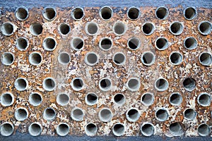 Tube sheet plate of heat exchanger or boiler closeup texture macro industrial background with insoluble hard mineral