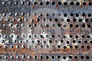 Tube sheet plate of heat exchanger or boiler closeup texture macro industrial background with insoluble hard mineral