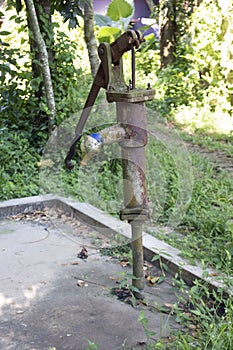 a tube well in a village in Bangladesh. fresh water in house.