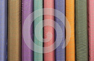 Tubes of Colorful Square Patterned Fabrics