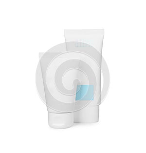 Tubes of different hand creams on white background. Mockup for design