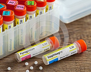 Tubes of homeopathy globules and first aid kit