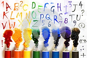 Tubes of paint with alphabet photo