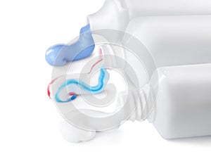 Tubes with toothpaste on white background. Dental care photo