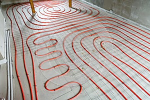 Tubes of the underfloor heating system on a styrofoam insulation