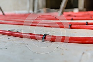 Tubes of the underfloor heating system on a styrofoam insulation