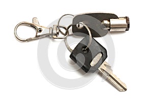 A tubular and a mechanical cut keys held by a keyring white backdrop