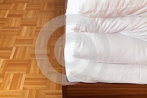 Tucked blanket and bed sheet in double bed