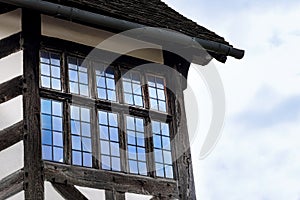 Tudor house exterior detail built in 1590 detail of window and roof Blakesley hall closeup