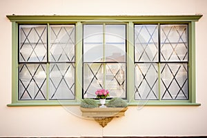tudor house window with diamondshaped panes photo