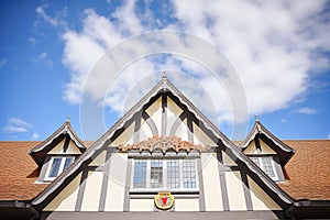 tudors front gable against cloudfilled sky
