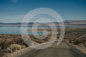 Tufa columns reflected in the mirrored water surface at Mono Lake, California