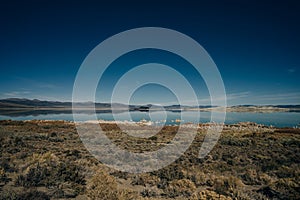 Tufa columns reflected in the mirrored water surface at Mono Lake, California