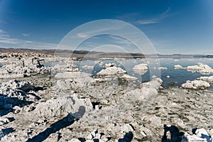 Tufa columns reflected in the mirrored water surface at Mono Lake, California