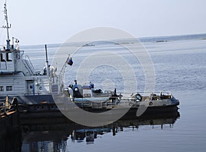 The Tug boat floats on the river