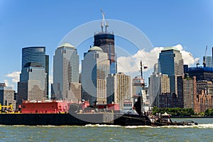 Tug Boat and Freighter head north along the Hudson in front of t