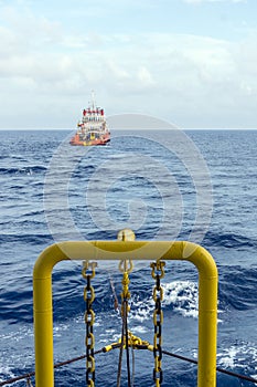 Tug boat towing a construction work barge