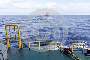 Tug boat towing a construction work barge