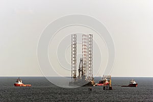 Tug boats positioning a jack up rig