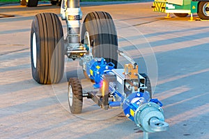 TUG carrier for an airplane, trailer front landing gear pushback aerodrome tractor, close up view