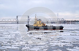 Tug and driving of ice on river