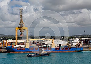 Tug at Freighter by Dock