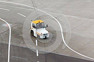 Tug and luggage on the airport tarmac