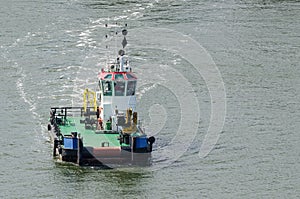 TUG IS MANEUVERING AT SEA