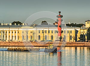 A tug on the Neva opposite the spit of Vasilievsky Island and the rostral column