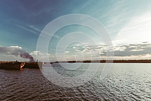 The tug pulls the barge