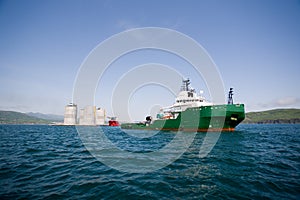 Tug towing offshore oil platform