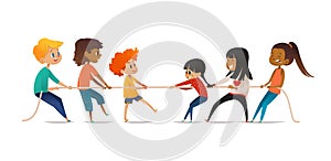 Tug of war contest between boys and girls. Two groups of children of different sex pulling opposite ends of rope
