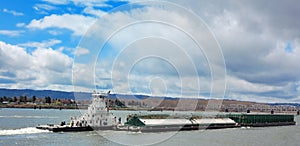 Tugboat and Barge on River