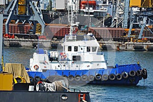 Tugboat and port cargo crane