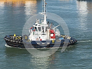 Tugboat crusing in harbor