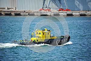 Tugboat in harbor quayside