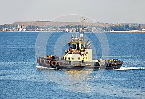 Tugboat in harbor quayside