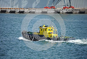 Tugboat in harbor quayside