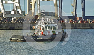 Tugboat leaving a harbor