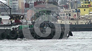 Tugboat moving in port river