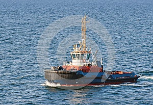 A tugboat navigates on the sea