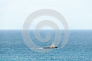 Tugboat Plows across the Caribbean Sea. photo