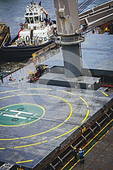 Tugboat and ship with helipad area