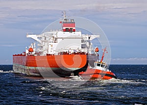 Tugboat towing tanker